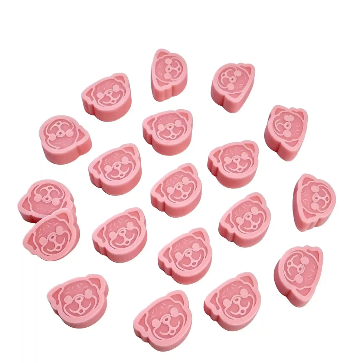 Twelve pink pug-shaped wax melts arranged on a white background, with a small text label at the top describing the quantity and dimensions.