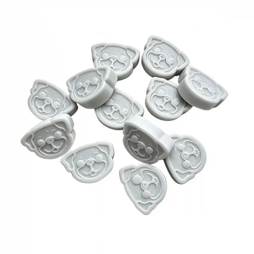 Twelve light gray pug-shaped wax melts arranged on a plain white background, with small descriptive text printed above them.