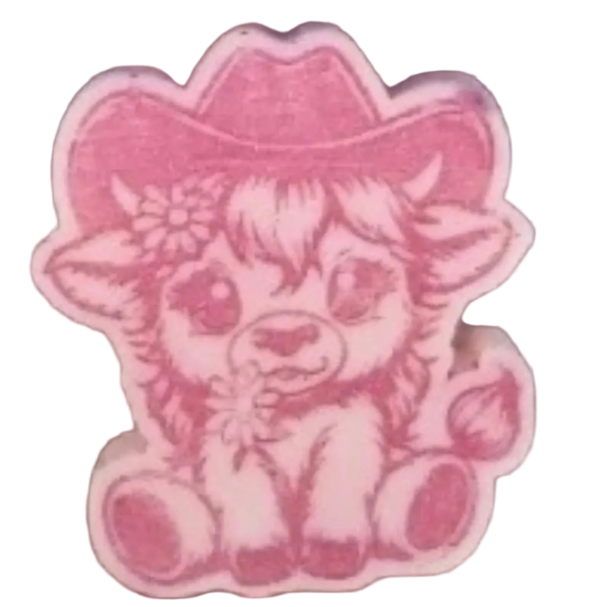 A pink WAX MELTS featuring a cartoon cowgirl calf design, shown on a textured brown surface.