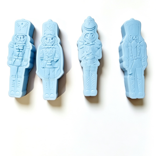 Four blue  wax melt soldier figurines on a white background