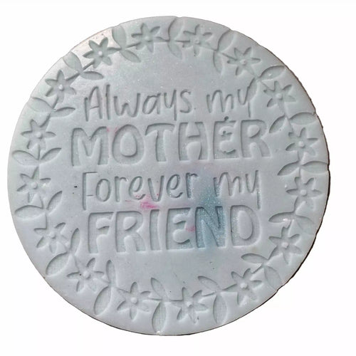 A round white decorative wax melt embossed text 'Always my MOTHER Forever my FRIEND' surrounded by a floral border, shown on a plain white background.