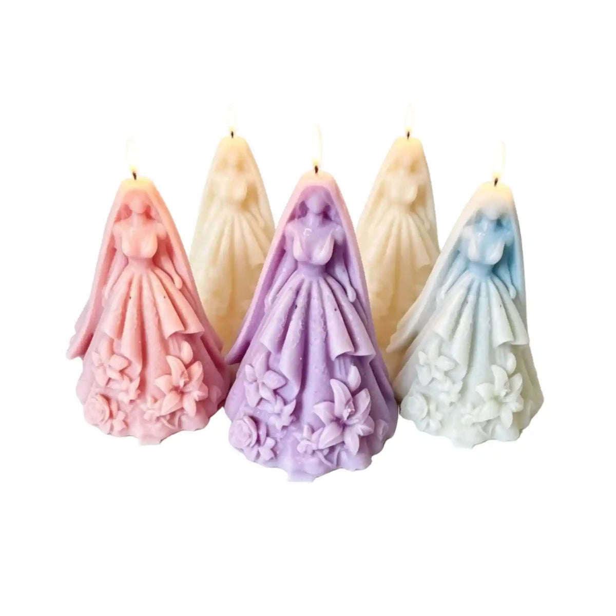 Four bride figurine candles in pastel colors, including pink, lavender, cream, and light blue, arranged against a plain white background.