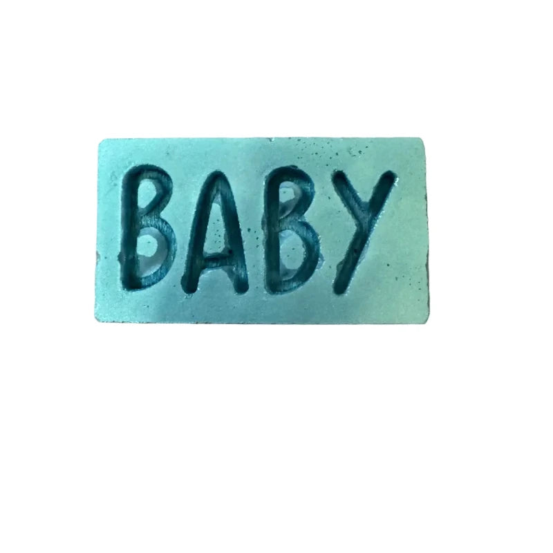 A rectangular wax melt with the word 'BABY' embossed in raised letters, shown on a plain white background.