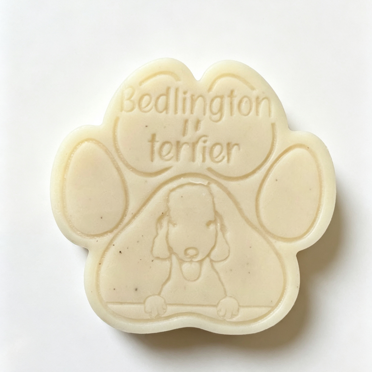 Paw-shaped wax melt with 'Bedlington terrier' text on a white background