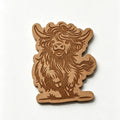 wax melt Highland cow ornament or plaque, showcasing a detailed engraved design of a shaggy cow on a plain white background.