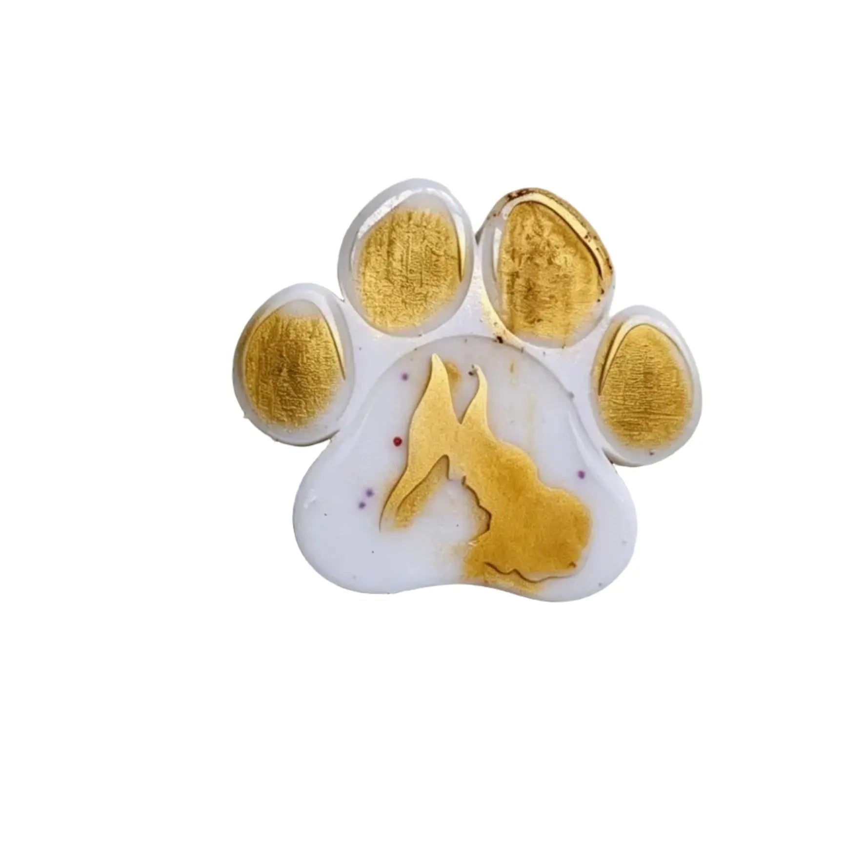 A paw print charm with a white base, gold leaf accents on the pads, and a small gold dog silhouette in the center, isolated on a white background. wax melt