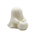 A small white wax melt of a cute ghost holding a pumpkin, set against a seamless light gray background.