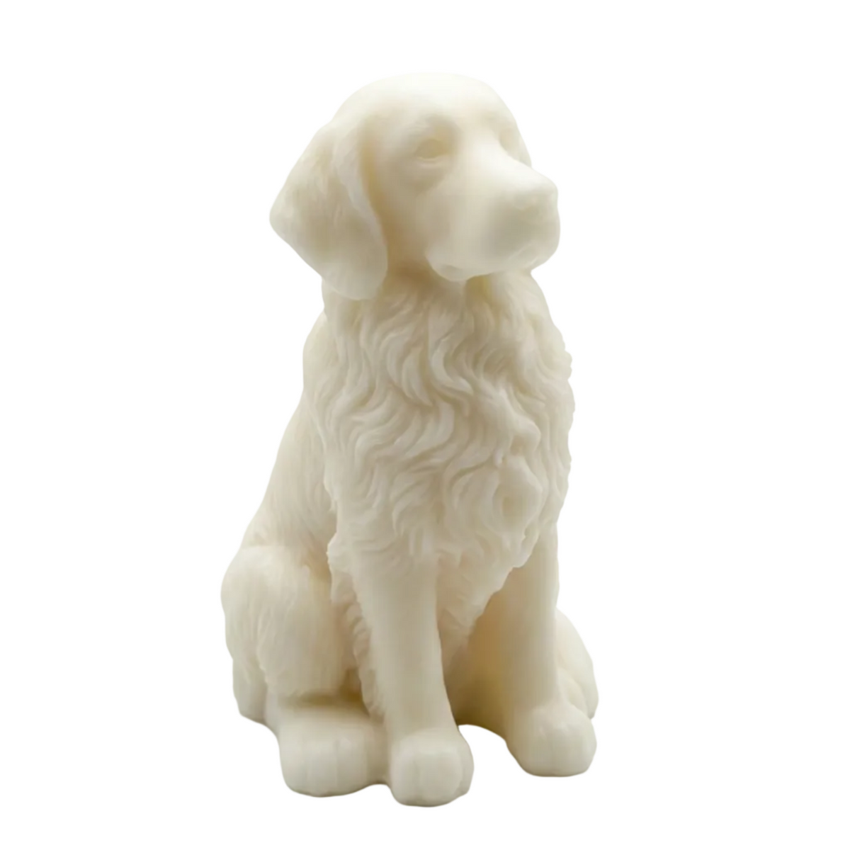 A small white dog candle  in a sitting position, shown against a plain light gray studio background. The figurine has long, curly fur details and a soft matte finish.