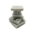 A small light gray sculpted figurine or WAX MELT CANDLE like a stack of books with a square top, photographed on a plain white background.