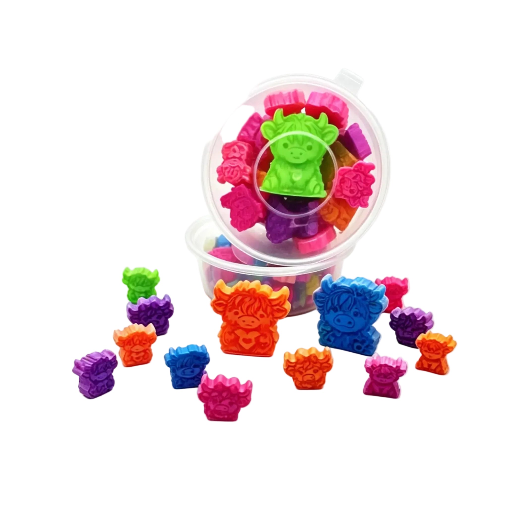 A clear plastic tub filled with small colorful bear-shaped items, with several loose bear-shaped pieces scattered in front on a white studio background. scoopies 
