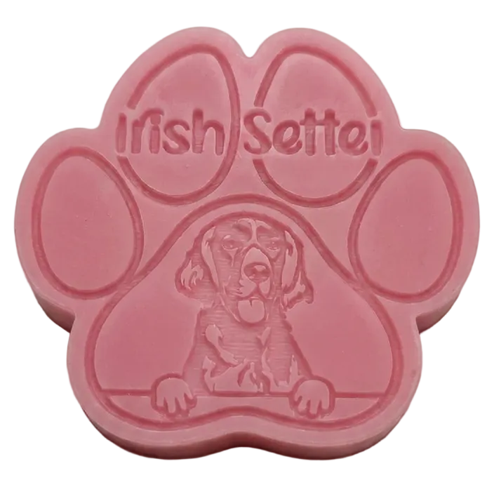 A pink paw-shaped Wax Melt featuring an embossed Irish Setter dog and the words 'Irish Setter' on the upper pad, shown against a plain white background.