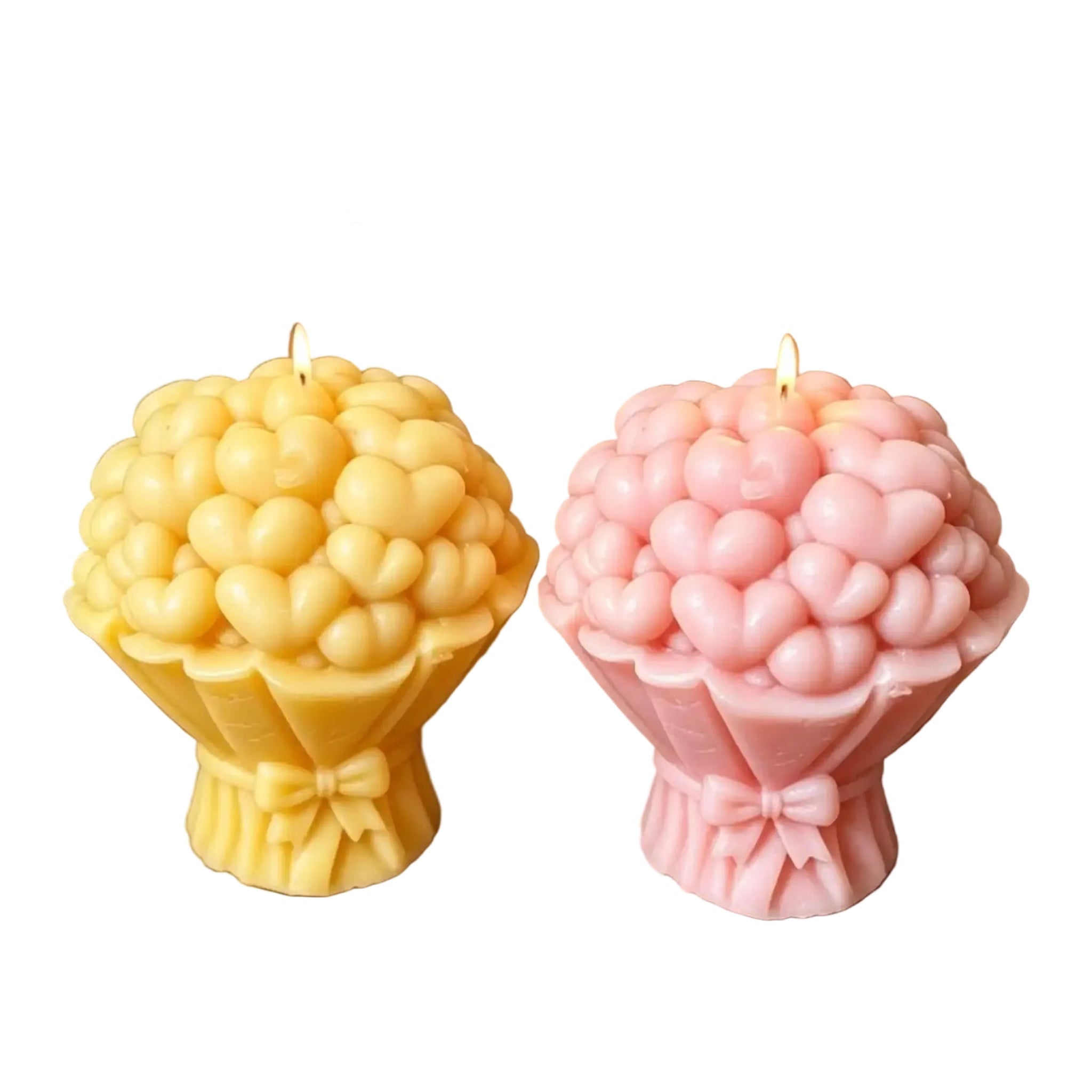 Two flower-shaped candles, one yellow and one pink, displayed on a woven wicker surface with text overlay indicating dimensions.