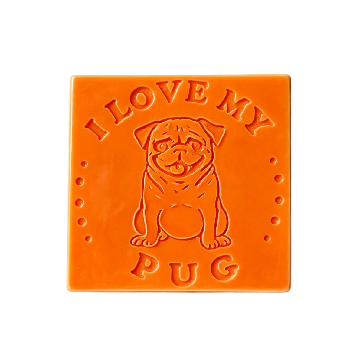 An orange square soap bar featuring an embossed pug dog illustration wax melt and the text 'I LOVE MY PUG' on a clean white background.