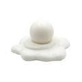 A white, sculptural product featuring a smooth melted snowman candle on a wavy, cloud-like base, photographed against a seamless light gray studio background.