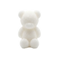 A small white teddy bear WAX MELT  or candle centered on a seamless white background.
