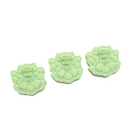Three light green decorative WAX MELT featuring a cow sitting on pumpkins, arranged in ascending sizes on a plain white background.