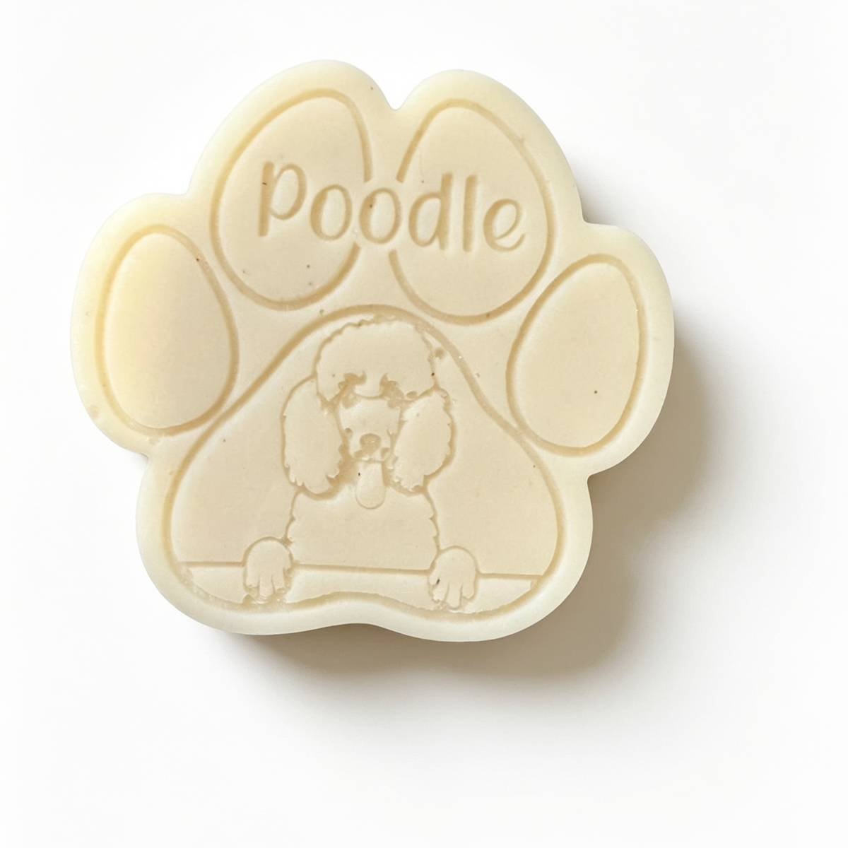 Paw-shaped wax melt with 'poodle' engraving on a white background