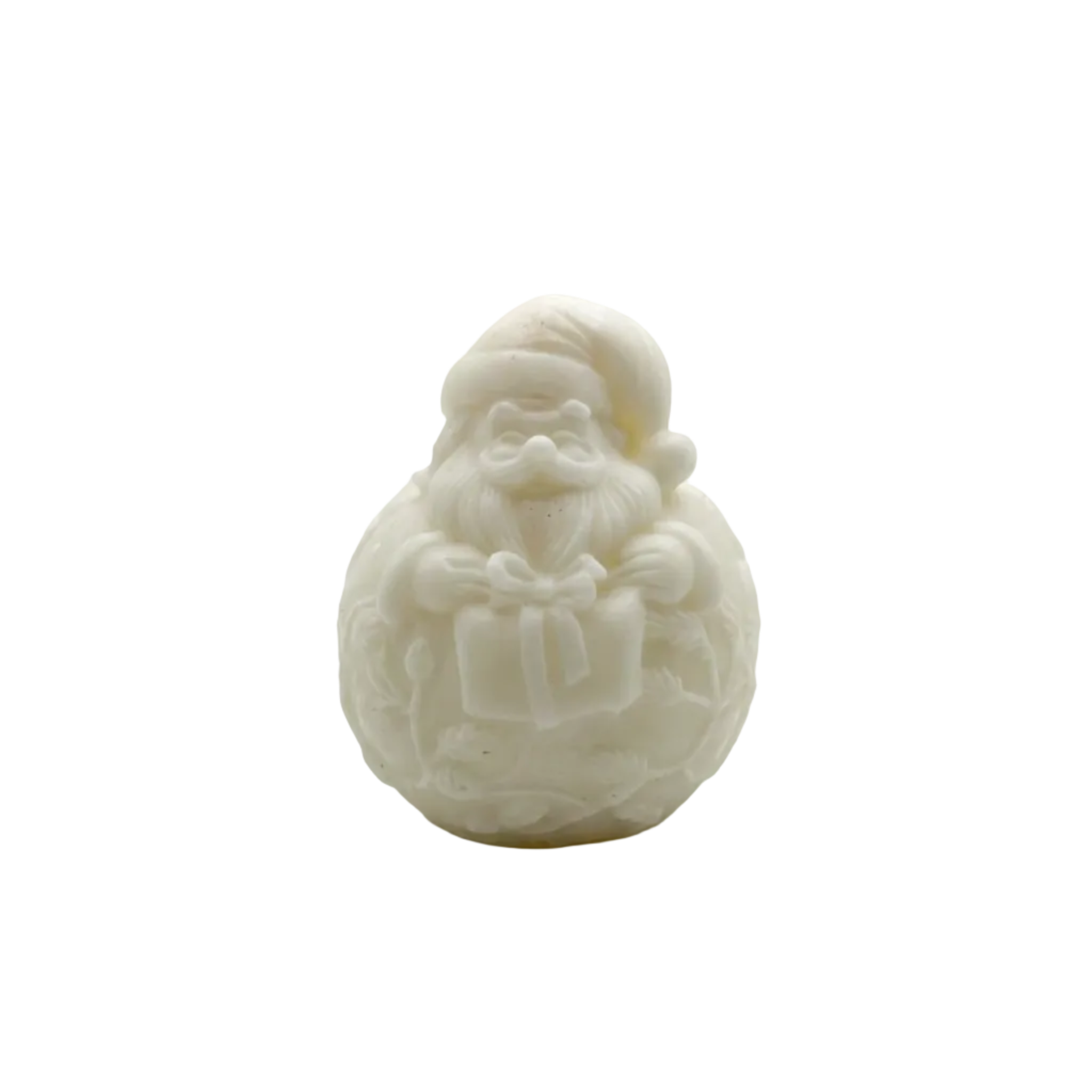 A small carved white CANDLE of Santa Claus holding a gift, photographed against a plain light gray to white studio background.