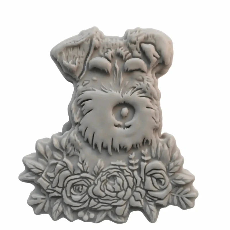 A gray sculpted wax melt figurine shaped like a Schnauzer dog's head with roses at the base, shown on a plain white background.