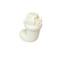 A small white CANDLE haped like a stocking or boot with a gift box and wrapped ornament on top, photographed on a clean white background.