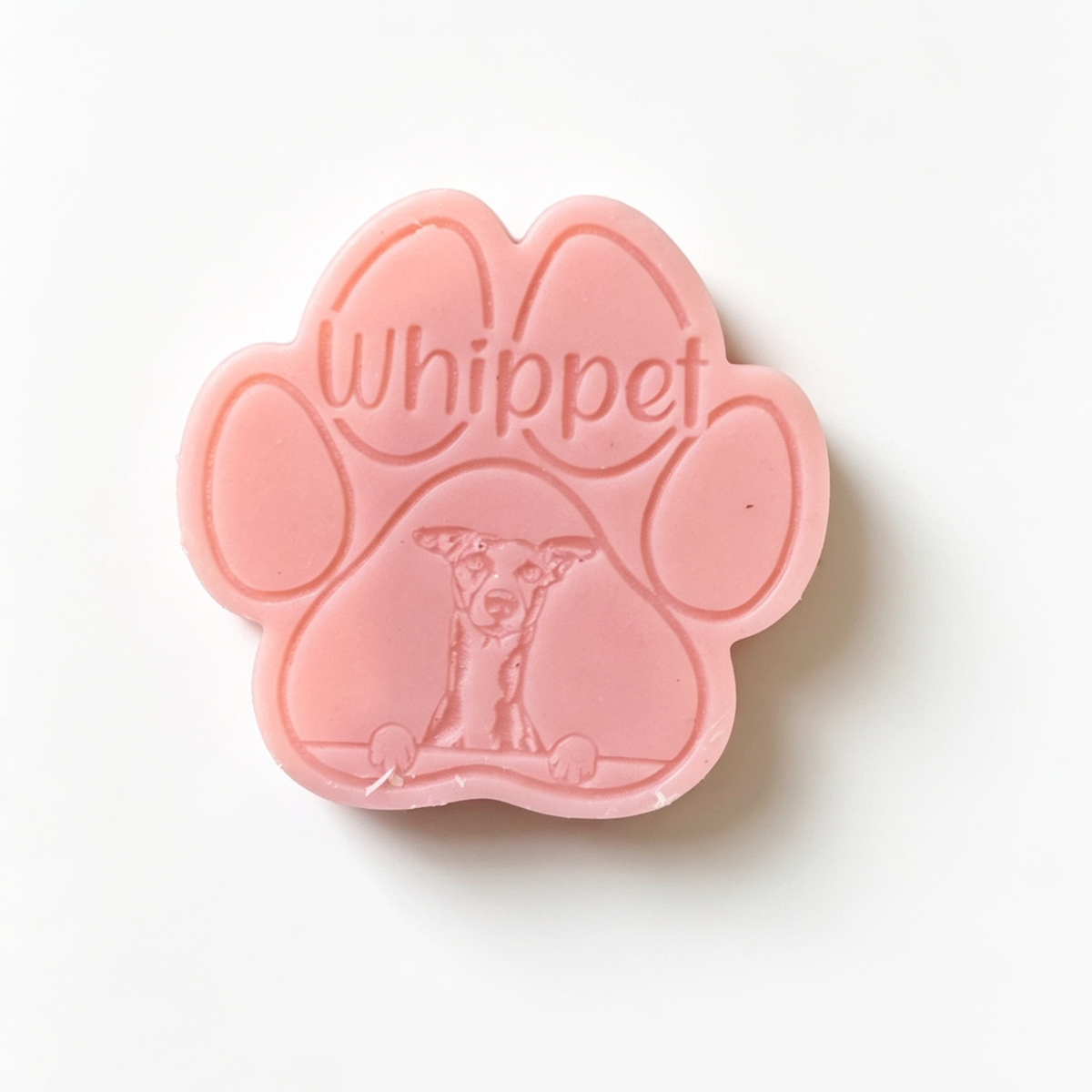 Pink paw-shaped Wax Melt with 'Whippet' text on a white background