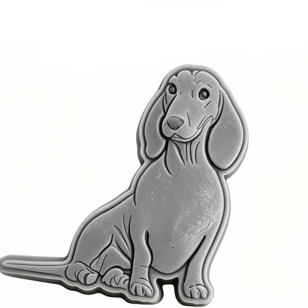 A silver metal cookie cutter shaped like a sitting dachshund, shown on a plain white background with black text at the top reading 'sizes approx 85mm x 73mm'.