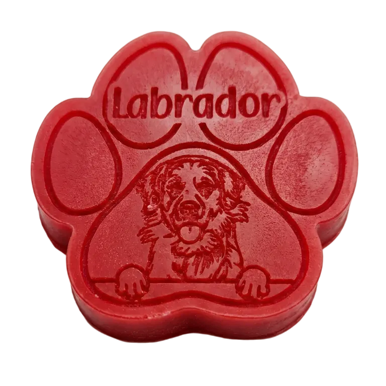 Red paw-shaped wax melt with 'Labrador' text and dog illustration on a white background