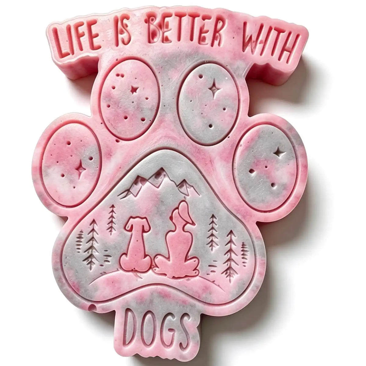 A pink and white marbled paw-shaped soap or candle with embossed text reading 'LIFE IS BETTER WITH DOGS' and a mountain-and-dog illustration, shown on a white background. WAX MELTS